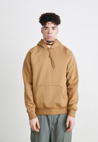 Brown hooded sweatshirt with a front pocket, drawstring closure, and ribbed cuffs. Smooth texture and relaxed fit.