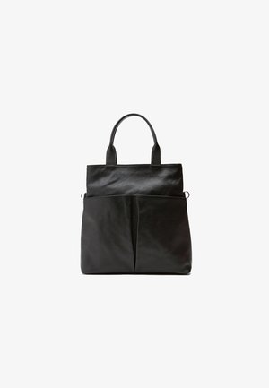 Black leather tote bag with textured surface, dual top handles, and a front pocket featuring a subtle pleat detail.