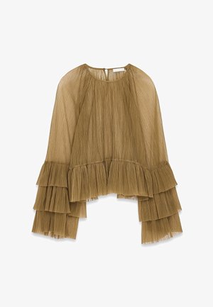 Haut plissé marron avec des manches évasées, présentant des volants superposés aux poignets et au cou. Fabriqué à partir d'un tissu léger et texturé.