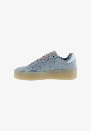 Light blue suede sneaker with thick translucent sole, mix of pink and blue laces, and stitched panel details, side view on white background.
