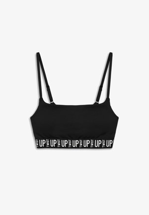 Brassière noire avec des bretelles réglables, dotée d'une texture lisse et d'un bandeau élastique imprimé portant la mention "TWIST UP" en blanc.