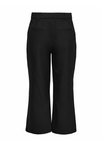 Schwarze, weit geschnittene, verkürzte Hose mit elastischem Bund und zwei Paspeltaschen hinten, von hinten gezeigt.