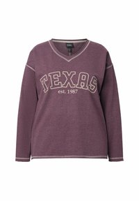 Sudadera a maniche lunghe viola con scollo a V, con la scritta "TEXAS" e "est. 1987" in crema. Sottile decorazione a punto sul colletto e sull'orlo.