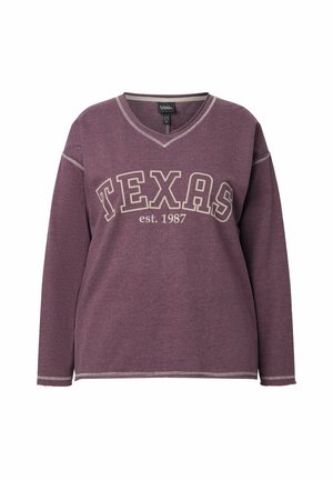 Fialová mikina s dlouhými rukávy a výstřihem do V, na které je napsáno "TEXAS" a "est. 1987" v barvě smetany. Jemné prošív ání na límci a lemu.