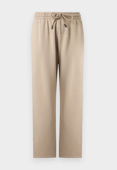 Μπεζ παντελόνι με φαρδιά μπατζάκια, ελαστική μέση με κορδόνι, λείο ύφασμα, χωρίς ορατά σχέδια ή τσέπες, εμφανίζεται από μπροστά.