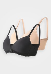 Two bras presented: one black with lace trim and bow detail, the other nude with smooth fabric. Both have adjustable straps and seamless cups.