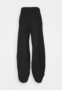 Black wide-leg pants made from a textured fabric. Features a high waist and a single back pocket. Smooth finish with a relaxed fit.