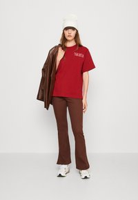 Puma Tričko s potlačou - intense red