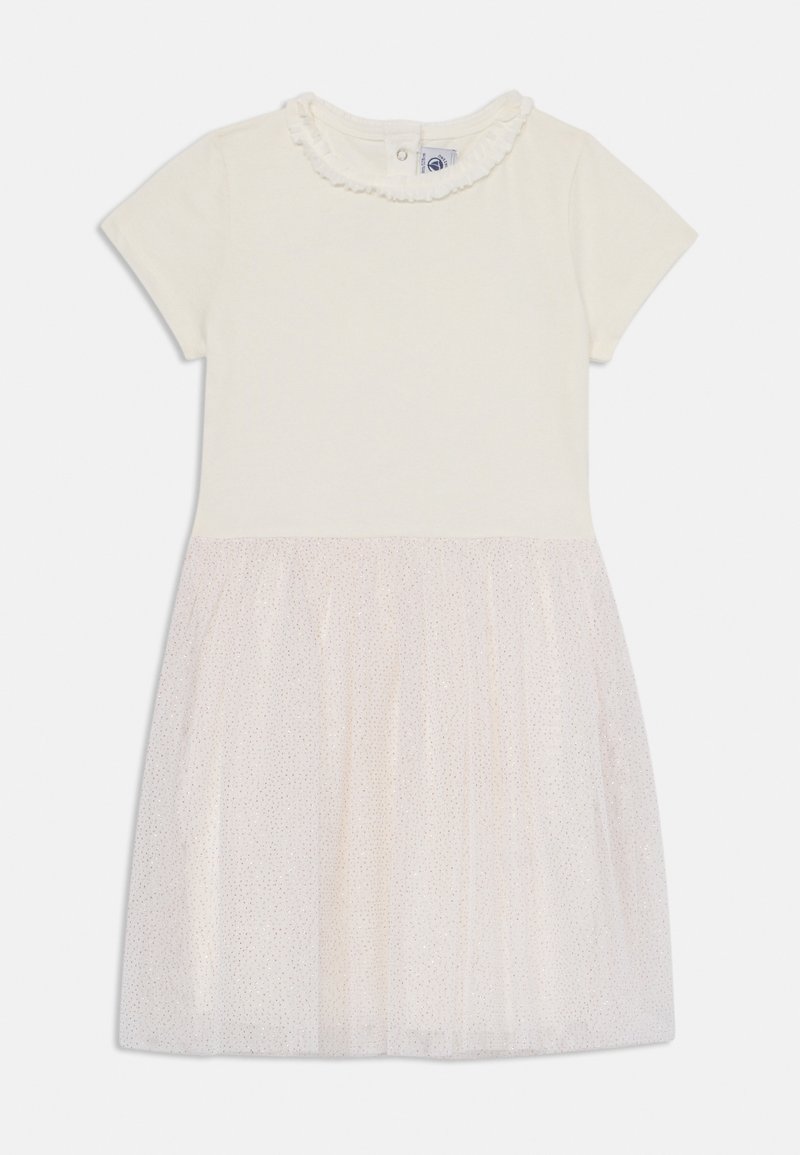 Īsām piedurknēm kleita ar mīkstu krēmkrāsas topu ar ripojošu apkakli un spīdīgu, caurspīdīgu rozā tutū svārku. Nodrošina vieglu uzvilkšanu ar pogām.