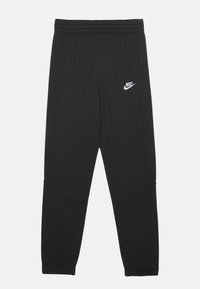Pantaloni sportivi neri con una vita elastica, gamba affusolata e logo Nike bianco sulla coscia sinistra. Texture liscia e senza motivi visibili.