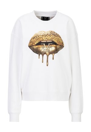 Sweat-shirt blanc avec un motif de lèvres en mosaïque dorée dégoulinant de peinture métallique et le texte "19 V 69 Italia" sur la poitrine.
