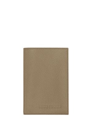 Taupe textured leather Longchamp wallet with embossed brand name on front, rectangular shape, minimalistic design.