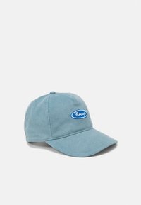 Blue corduroy baseball cap featuring an embroidered blue "Recap" logo on a white oval patch, with a curved brim and textured surface.
