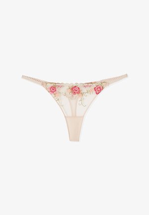 String beige transparent avec broderie florale rose et rouge et bords festonnés à la taille.