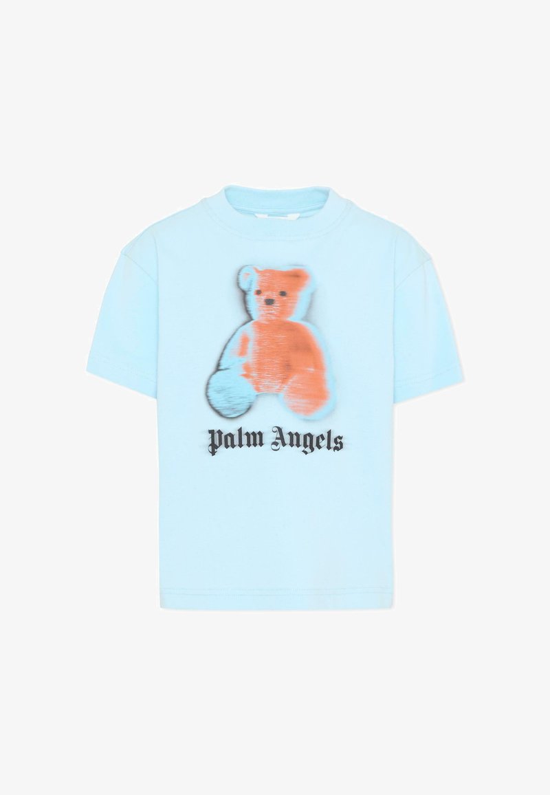 T-shirt bleu clair à manches courtes présentant un motif flou d'ours en peluche orange et le texte "palm angels" en police gothique noire en dessous.