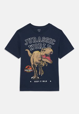 Tamno plavi pamučni majica s velikom grafikom dinosaura, tekstom "Jurassic World" i kružnim logom s natpisom "Keep It Wild" ispod.