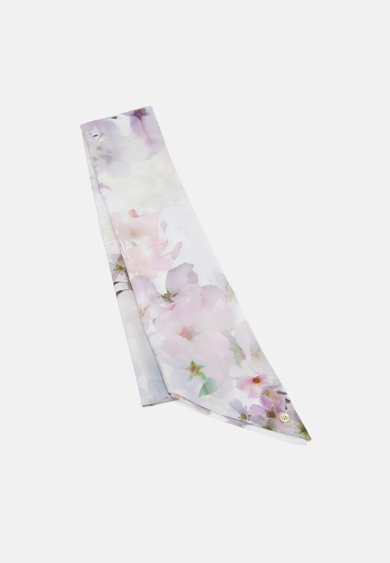 Écharpe florale pastel clair avec des tons doux de rose, violet et vert, soigneusement pliée sur un fond blanc uni.