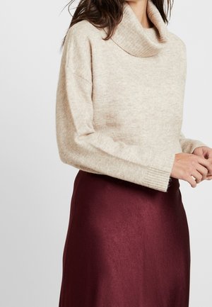 Stickad tröja - beige