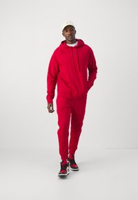 Jordan Kapuzenpullover - gym red/black