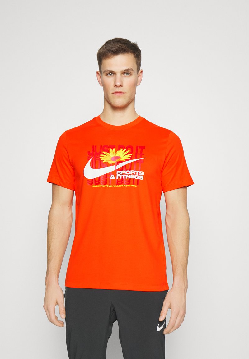 Nike Performance TEE WILD CARD Sports Tshirt team orange/orange Zalando.co.uk