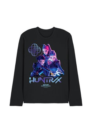 Black long-sleeve shirt with three animated female characters in neon lighting and "HUNTRX K-POP DEMON HUNTERS" text below.