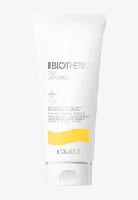 Biotherm revitaliserende dusjgel i en hvit, klembar tube. Nøkkelopplysninger: 200ml, gul aksent med tekst som beskriver ingredienser og bruk.