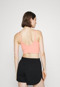 Athleta ELATION V-NECK CROP A-C - Sutiã desportivo de suporte ligeiro - sunset glow