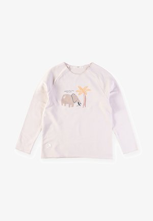 Lyse lilla langærmet skjorte med raglanærmer, prydet med et grafik af en elefant og et palmetræ i bløde jordfarver. Blødt bomuldsstof.