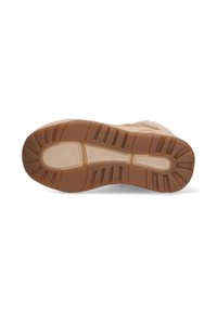 Semelle de chaussure avec une partie supérieure en caoutchouc texturé beige clair et un motif de grip marron contrastant, conçu pour l'adhérence.