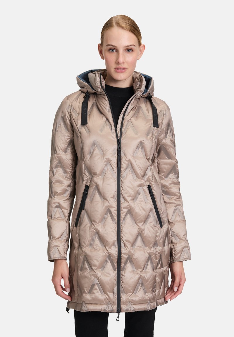 Beige gewatteerde jas met een geometrisch quiltpatroon, zwarte ritssluiting, zijzakken en een capuchon met verstelbare bandjes.