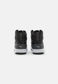 Black high-top sneakers with padded ankle support, grey accents, textured synthetic upper, white midsole, and logo detail on the heel.