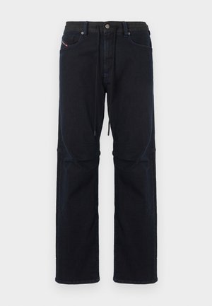 Pantalones de mezclilla azul marino oscuro con un ajuste holgado, que cuentan con cintura con cordón, cinco bolsillos y costuras contrastantes sutiles.