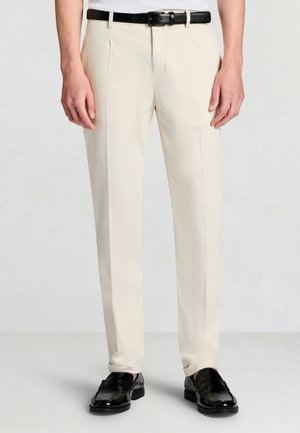 LUNGO TINTA UNITA - Pantaloni - sabbia