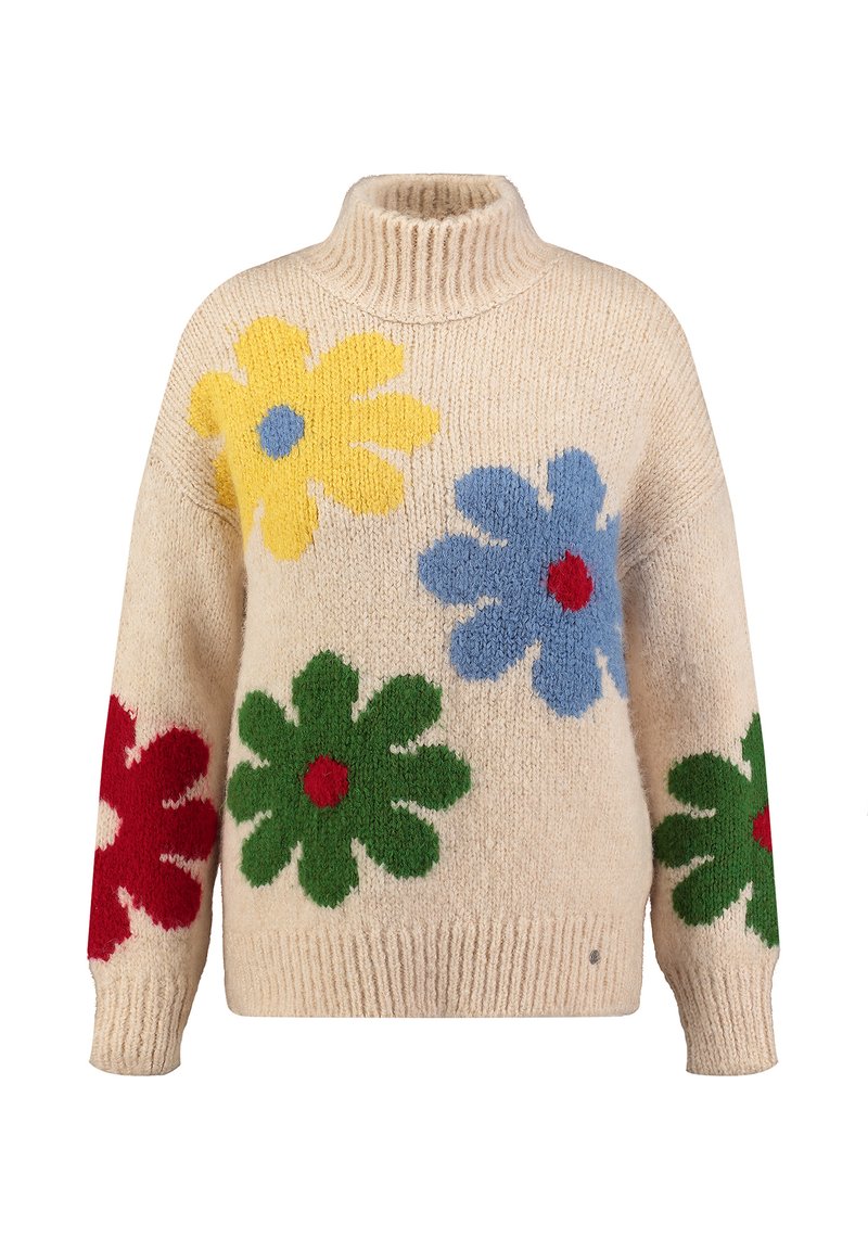 Sweter robiony na drutach w kolorze kremowym z wysokim kołnierzem. Posiada kolorowe wzory kwiatowe z wełny w żółtym, niebieskim, czerwonym i zielonym kolorze na przodzie i rękawach.