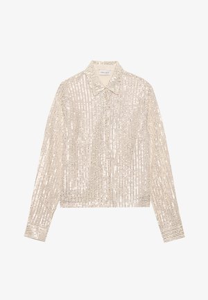 Béžová trblietavá blúzka s klasickým golierom, dlhými rukávmi a gombíkovým zapínaním, so vzorom vertikálnych pruhov na materiáli.