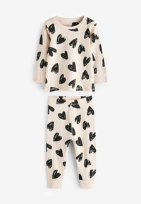 Set di pigiama composto da top e pantaloni in morbido tessuto a costine. Beige chiaro con stampa di cuori neri sparsi, caratterizzato da maniche lunghe e una vita elasticizzata.