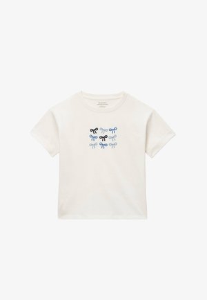 T-shirt blanc manches courtes pour enfants avec neuf petits nœuds brodés en noir, bleu foncé et bleu clair centrés sur le devant.