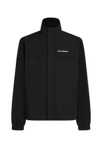 Schwarze Jacke mit hohem Kragen, elastischen Bündchen und zwei Fronttaschen. Mit Logo auf der oberen linken Seite in Weiß. Glattes, wasserabweisendes Material.