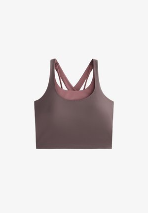 Podprsenka v mauve odstínu, s designem na závodní záda a zkříženými popruhy. Vyrobena z hladkého, elastického materiálu. Minimalistický tvar a bezešvé provedení.