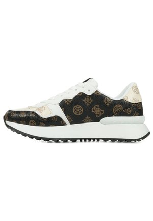 Sneaker con una parte superiore a motivi neri e beige che presenta loghi. Accenti in pelle bianca e una suola bianca spessa con battistrada testurizzato.