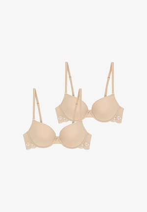 Two light beige bras with smooth, padded cups, adjustable straps, and lace trim featuring floral accents and hook-and-eye closures.
