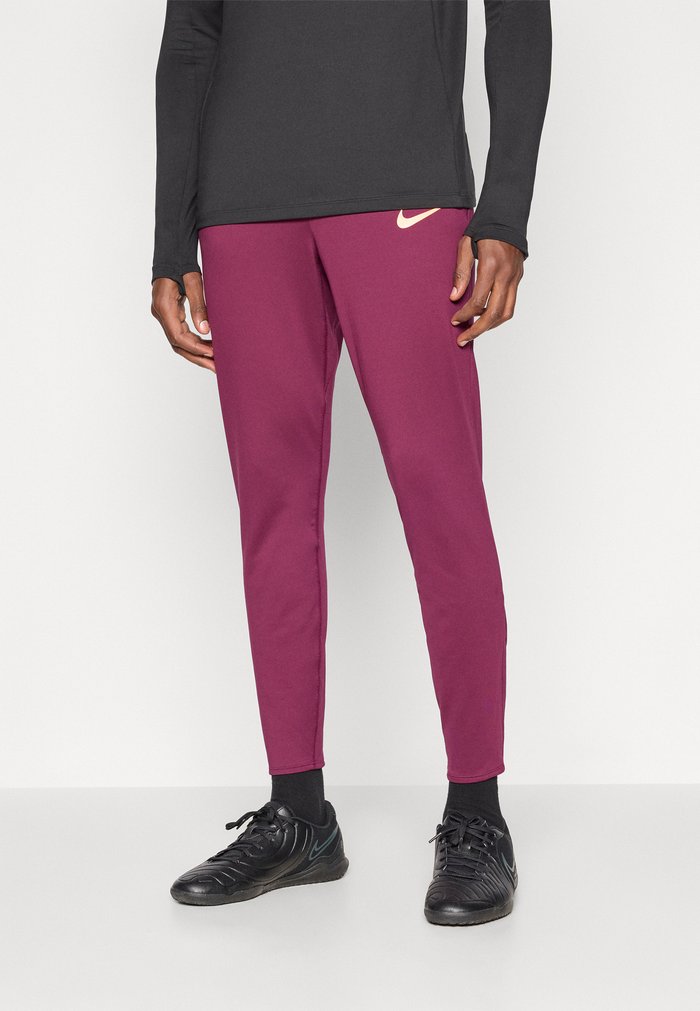 Nike M NK DF STRK PANT KPZ - Tracksuit bottoms - bordeaux/orange pulse