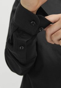 Jack & Jones Junior JJEAXEL czarny