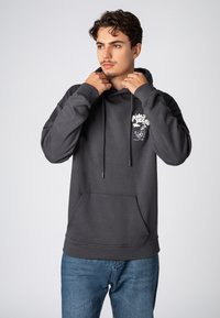 Donkergrijze hoodie met een voorzak (kangaroozak), trekkoord in de capuchon en een grafische print op de linkerborst. Gemaakt van een katoenmix, met een casual pasvorm.