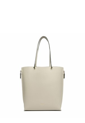 Beige Tragetasche mit zwei dünnen Schulterriemen und einem kleinen goldenen Logo in der unteren Mitte, auf weißem Hintergrund.