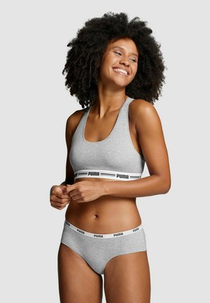 Grauer Sport-BH und passende Unterhose mit einem schwarz-weißen Logo-Bund. Weicher Stoff, figurbetontes Design und tiefer Rückenausschnitt für Komfort.