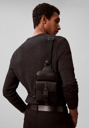 Calvin Klein, CALVIN KLEIN EMBLEM LOGO SLING BAG - Borsa a tracolla - black