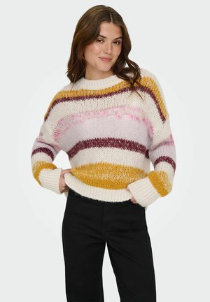 Jersey de punto grueso con rayas horizontales en crema, rosa, burdeos y mostaza. Puños y dobladillo acanalados con un ajuste relajado.