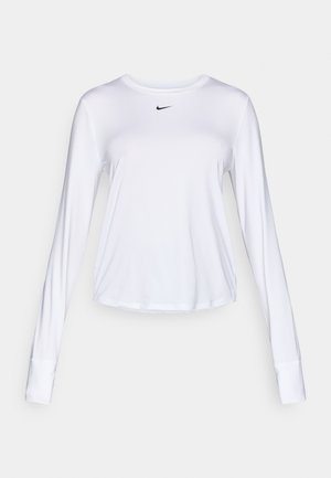 Hvit langermet treningsskjorte med rund hals, med en liten svart Nike-logo på brystet og elastisk, glatt stoff.
