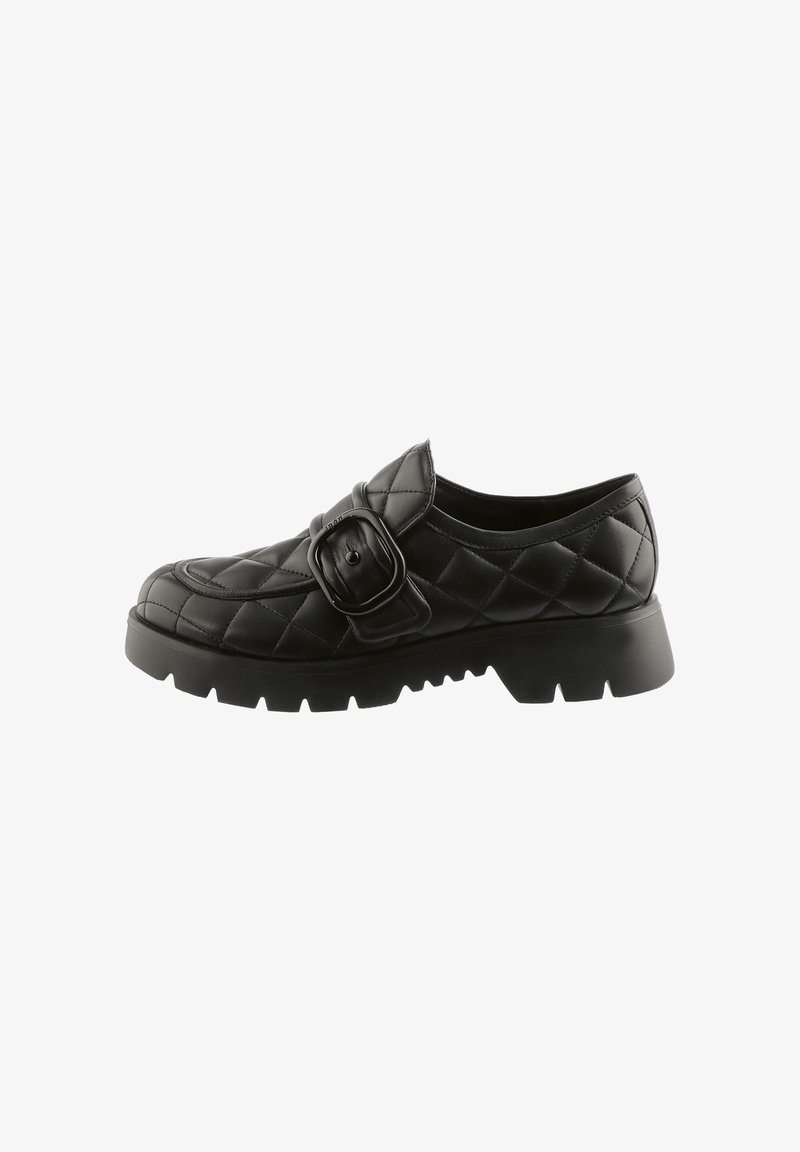 Black quilted leather shoe with a rounded toe, featuring a wide strap and buckle detail. Thick rubber sole with traction grooves.